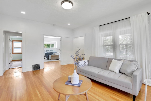 2116 N Jefferson St, Spokane, WA 99205 - living area featuring light wood-type flooring and recessed lighting