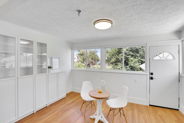 2116 N Jefferson St, Spokane, WA 99205 - dining room featuring a textured ceiling, light wood-style flooring, and healthy amount of natural light