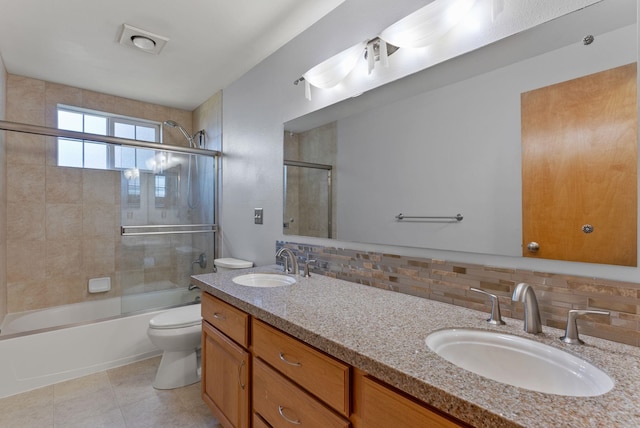 11919 S Player Dr, Spokane, WA 99223 - bathroom with tasteful backsplash, combined bath / shower with glass door, and double vanity