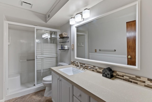 11919 S Player Dr, Spokane, WA 99223 - bathroom with decorative backsplash, a shower stall, vanity, and crown molding