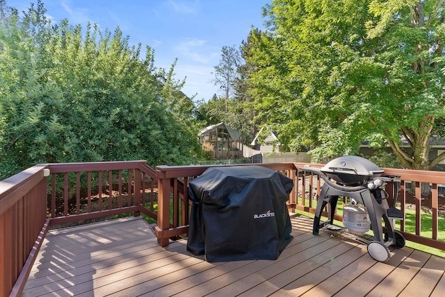 11919 S Player Dr, Spokane, WA 99223 - wooden deck with a grill