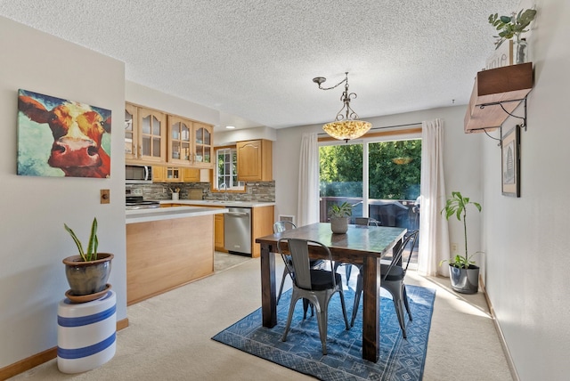 11919 S Player Dr, Spokane, WA 99223 - dining area with light colored carpet and a textured ceiling