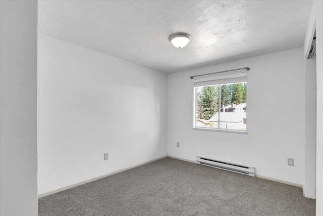 10109 E 9th Ave, Spokane Valley, WA 99206 - carpeted empty room with a baseboard heating unit and baseboards