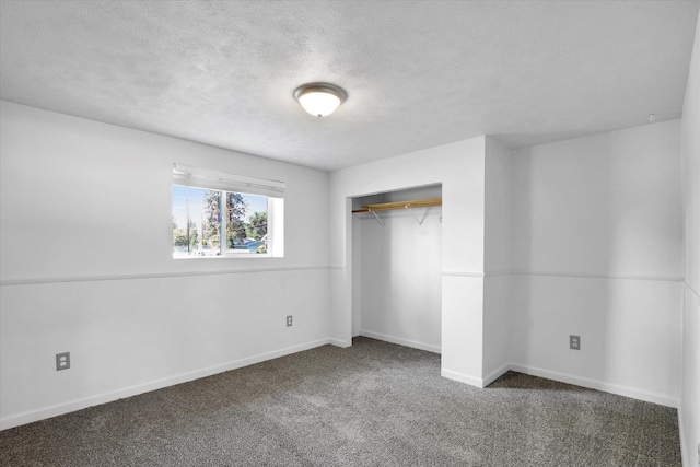 10109 E 9th Ave, Spokane Valley, WA 99206 - unfurnished bedroom featuring carpet, a textured ceiling, and a closet