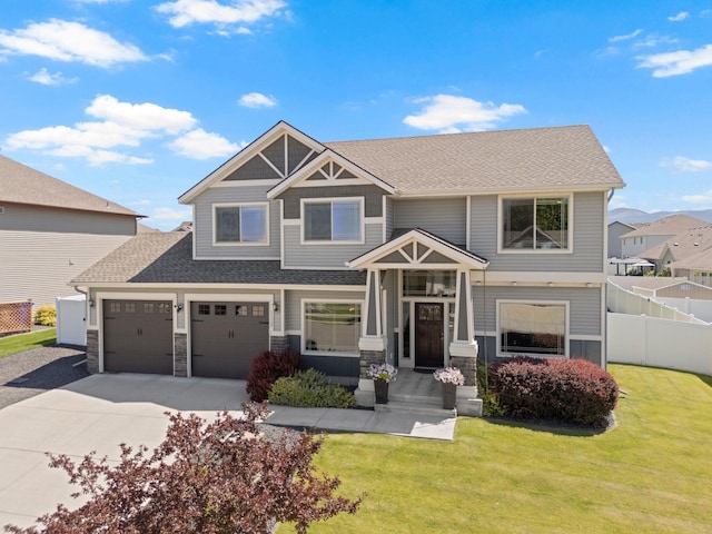 1115 S Mcmillan Rd, Spokane Valley, WA 99016 - view of front of property featuring concrete driveway, a shingled roof, stone siding, and a garage