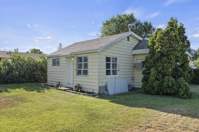 7225 E 11th Ave, Spokane, WA 99212 - view of side of home with a lawn and a shingled roof