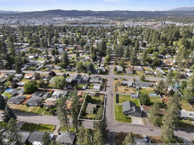 7225 E 11th Ave, Spokane, WA 99212 - aerial view of property and surrounding area with property boundaries highlighted and nearby suburban area
