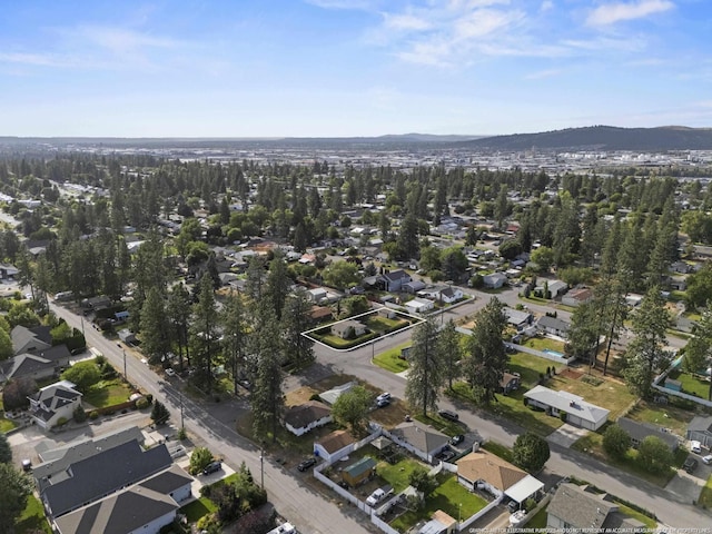 7225 E 11th Ave, Spokane, WA 99212 - aerial view of property's location with nearby suburban area and a mountain backdrop