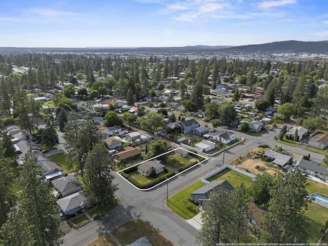 7225 E 11th Ave, Spokane, WA 99212 - aerial overview of property's location with nearby suburban area, property parcel outlined, and a mountain backdrop