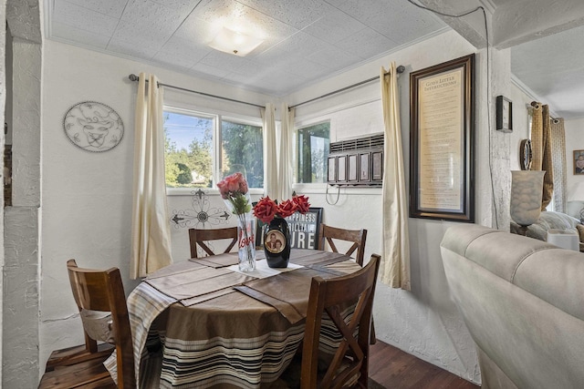 7225 E 11th Ave, Spokane, WA 99212 - dining room with wood finished floors, a textured wall, and crown molding