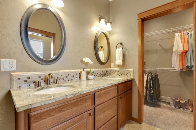 202 E Alexa Ct, Spokane, WA 99208 - bathroom with double vanity, backsplash, and a spacious closet
