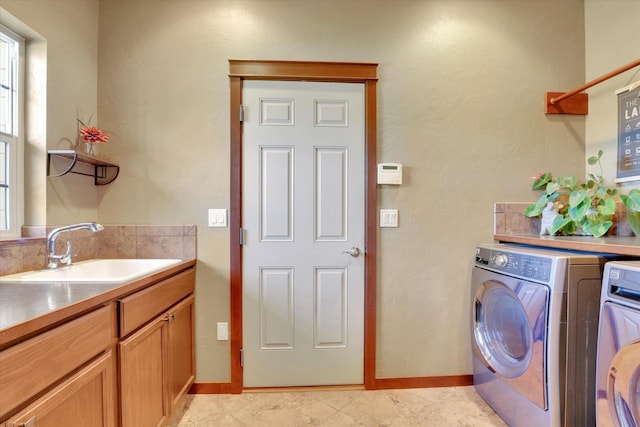 202 E Alexa Ct, Spokane, WA 99208 - washroom featuring washing machine and dryer and cabinet space
