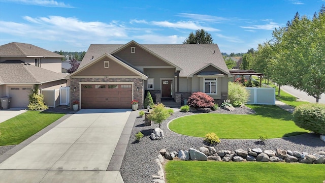 202 E Alexa Ct, Spokane, WA 99208 - craftsman-style house featuring concrete driveway, an attached garage, and stone siding