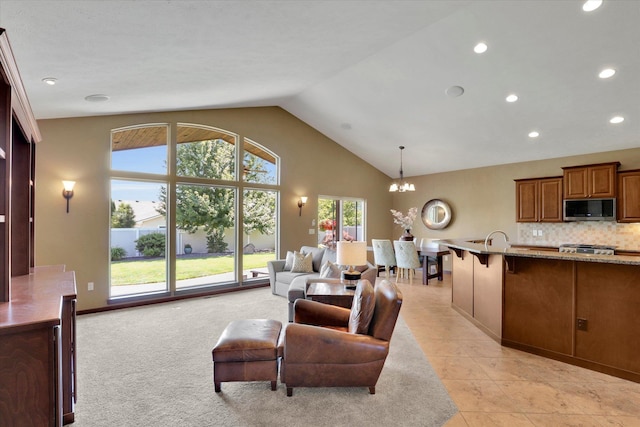 202 E Alexa Ct, Spokane, WA 99208 - living area with a chandelier, plenty of natural light, recessed lighting, and high vaulted ceiling