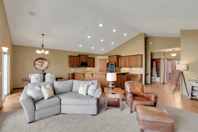 202 E Alexa Ct, Spokane, WA 99208 - living room featuring recessed lighting, a chandelier, high vaulted ceiling, and light tile patterned floors