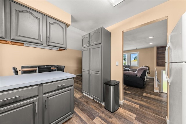 14020 S Sharp Ave, Spokane Valley, WA 99216 - laundry room with dark wood-type flooring and recessed lighting