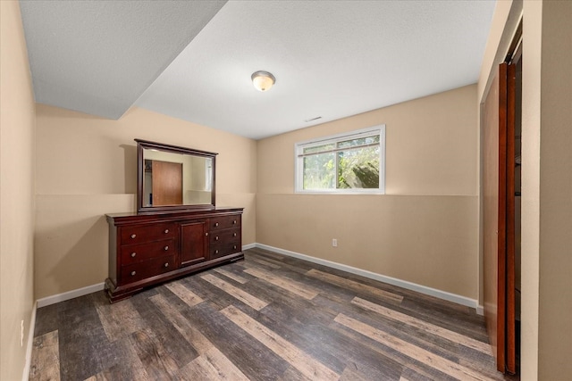 14020 S Sharp Ave, Spokane Valley, WA 99216 - unfurnished bedroom featuring dark wood-style floors and baseboards