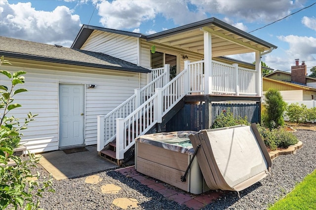 14020 S Sharp Ave, Spokane Valley, WA 99216 - back of property featuring a shingled roof, stairway, and a hot tub