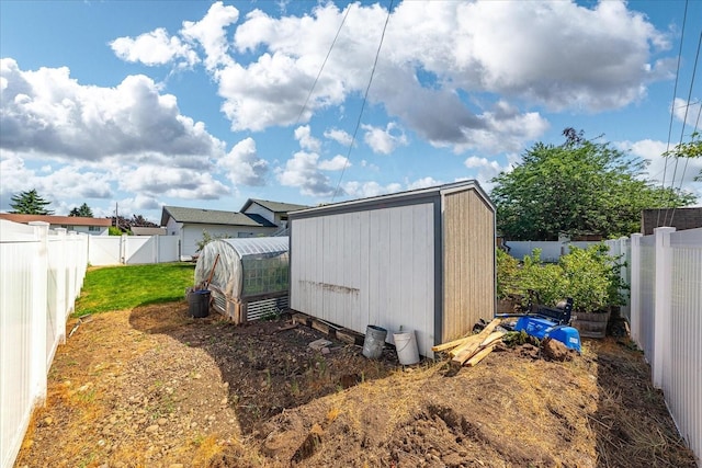 14020 S Sharp Ave, Spokane Valley, WA 99216 - view of greenhouse with a fenced backyard and a storage shed