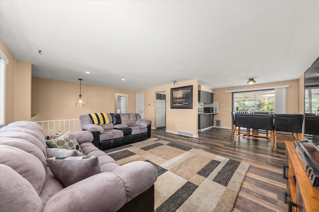 14020 S Sharp Ave, Spokane Valley, WA 99216 - living room featuring dark wood-type flooring and recessed lighting