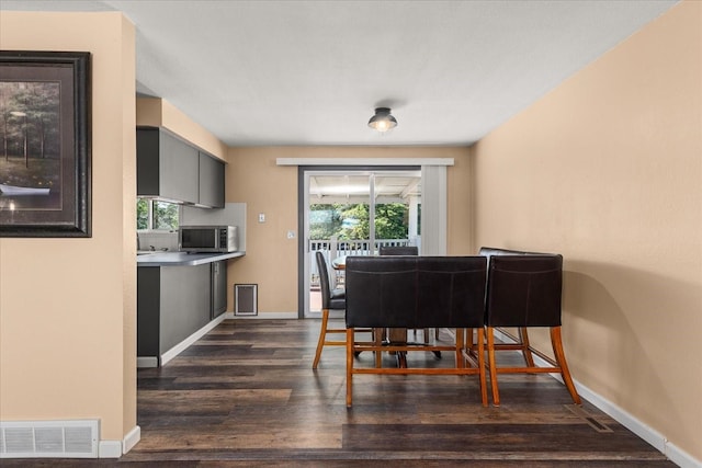 14020 S Sharp Ave, Spokane Valley, WA 99216 - dining room with dark wood-type flooring and baseboards