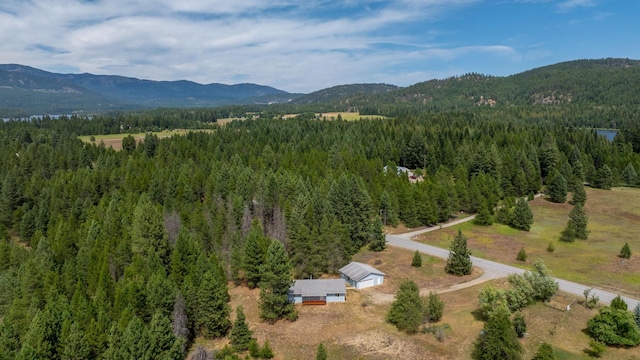 9801 Lakeshore Dr, Sagle, ID 83860 - bird's eye view of a heavily wooded area and a mountainous background