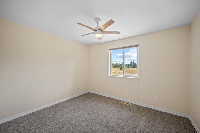 9801 Lakeshore Dr, Sagle, ID 83860 - spare room featuring carpet flooring and a ceiling fan