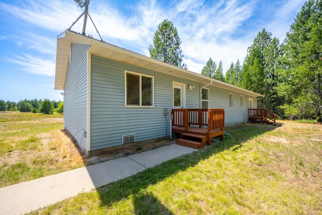 9801 Lakeshore Dr, Sagle, ID 83860 - view of front of home with a front lawn and a deck