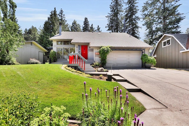 2714 E 11th Ave, Spokane, WA 99202 - view of front facade with driveway, an attached garage, a front lawn, and an outdoor structure