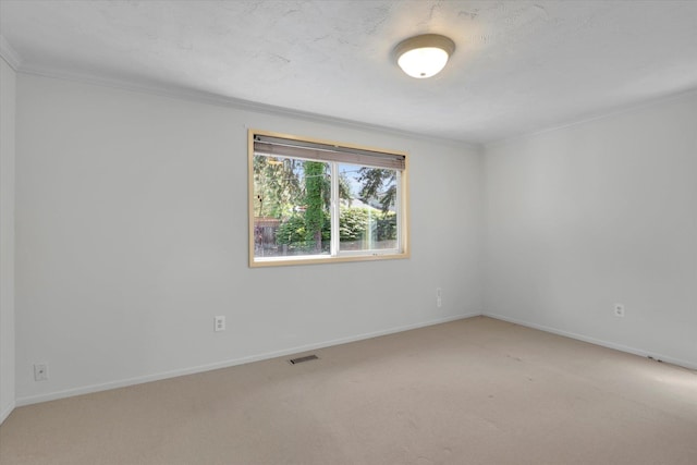 2714 E 11th Ave, Spokane, WA 99202 - spare room with light carpet and crown molding
