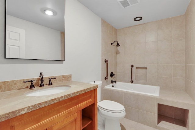 2714 E 11th Ave, Spokane, WA 99202 - bathroom with vanity, tiled shower / bath combo, and tile patterned flooring
