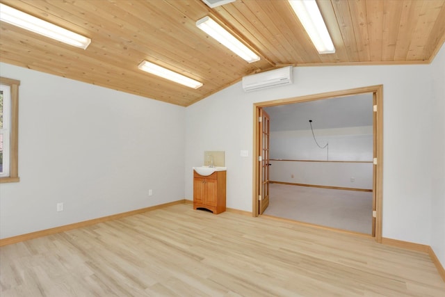 2714 E 11th Ave, Spokane, WA 99202 - unfurnished room featuring light wood-style floors, a wall unit AC, lofted ceiling, and wood ceiling