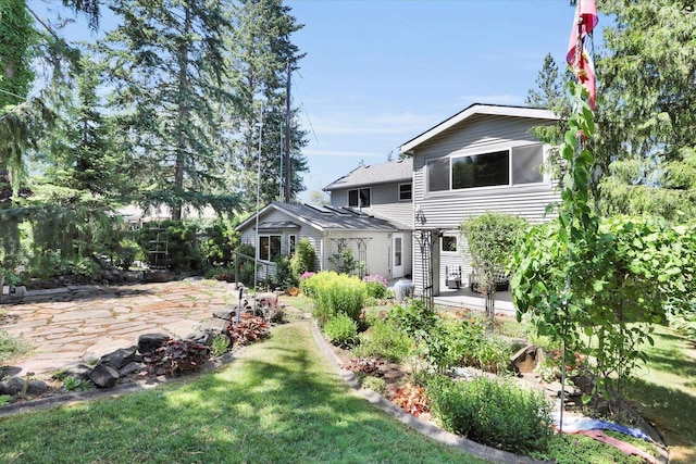 2714 E 11th Ave, Spokane, WA 99202 - rear view of property with a patio area and a lawn