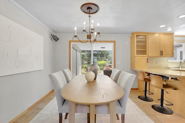 2714 E 11th Ave, Spokane, WA 99202 - dining space featuring light tile patterned floors, ornamental molding, a chandelier, and recessed lighting