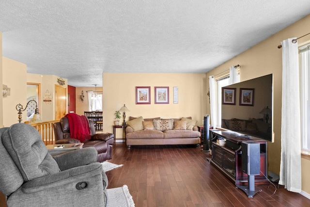 7905 W Seven Mile Rd, Nine Mile Falls, WA 99026 - living room featuring plenty of natural light, dark wood-type flooring, and a textured ceiling