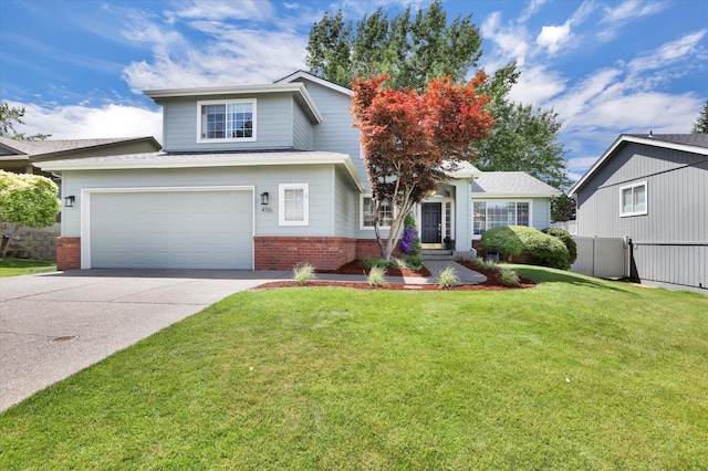 4116 S S Tenfel Ln, Spokane, WA 99223 - view of front of home featuring brick siding, driveway, and an attached garage