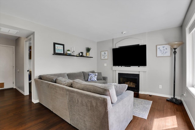 4116 S S Tenfel Ln, Spokane, WA 99223 - living area with dark wood-style flooring and a fireplace