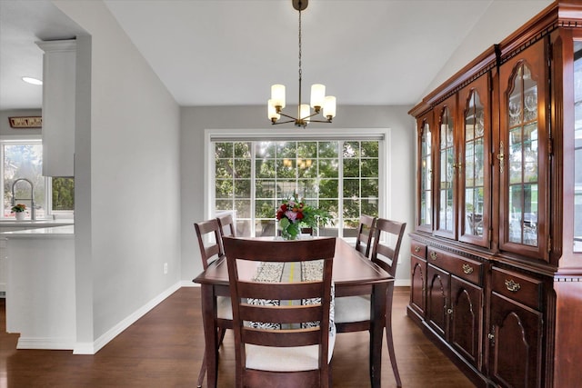 4116 S S Tenfel Ln, Spokane, WA 99223 - dining area featuring dark wood-type flooring, a chandelier, and vaulted ceiling
