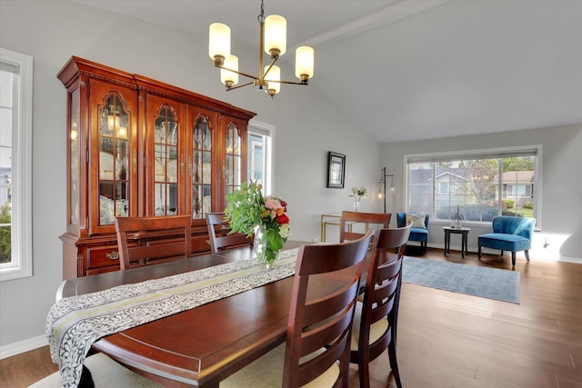4116 S S Tenfel Ln, Spokane, WA 99223 - dining area with wood finished floors, a chandelier, and lofted ceiling