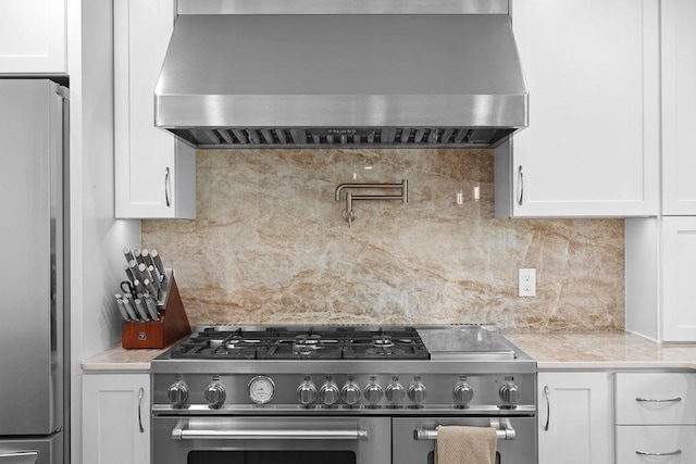 3929 S Best Ct, Veradale, WA 99037 - kitchen featuring wall chimney exhaust hood, appliances with stainless steel finishes, light countertops, and decorative backsplash