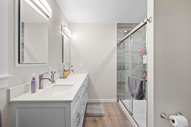 3929 S Best Ct, Veradale, WA 99037 - full bath featuring double vanity, a shower stall, and wood finished floors