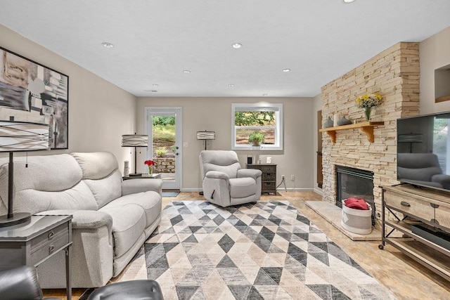 3929 S Best Ct, Veradale, WA 99037 - living room with a stone fireplace, recessed lighting, and light tile patterned floors
