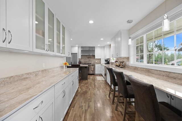 3929 S Best Ct, Veradale, WA 99037 - kitchen featuring appliances with stainless steel finishes, white cabinets, glass insert cabinets, backsplash, and recessed lighting