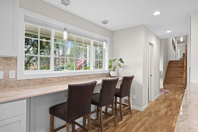 3929 S Best Ct, Veradale, WA 99037 - dining room featuring light wood-type flooring, recessed lighting, and stairway