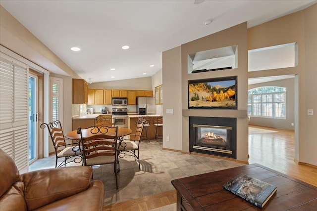 4211 S Greystone Ln Unit 4211, Spokane, WA 99223 - living room with vaulted ceiling and a glass covered fireplace