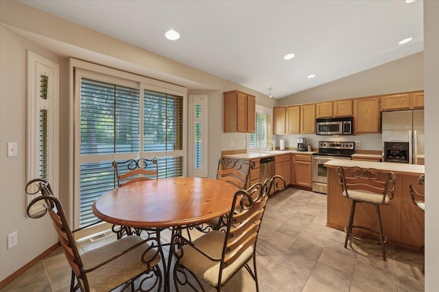 4211 S Greystone Ln Unit 4211, Spokane, WA 99223 - dining area with vaulted ceiling, recessed lighting, and light tile patterned floors