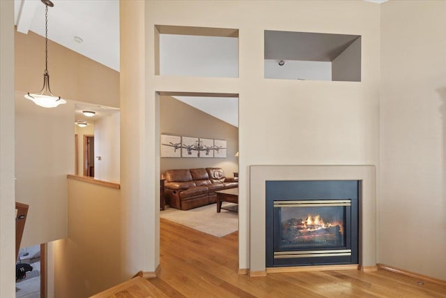 4211 S Greystone Ln Unit 4211, Spokane, WA 99223 - living room featuring wood finished floors, high vaulted ceiling, and a glass covered fireplace
