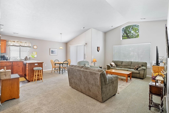 1636 E Vanetta Ln, Spokane, WA 99217 - living room with lofted ceiling, light colored carpet, and healthy amount of natural light