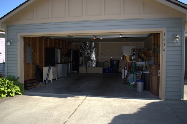 1636 E Vanetta Ln, Spokane, WA 99217 - garage with driveway, electric panel, and electric water heater