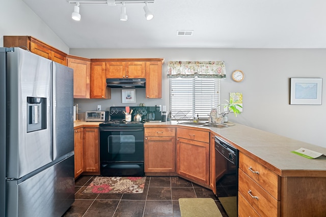 1636 E Vanetta Ln, Spokane, WA 99217 - kitchen with black appliances, under cabinet range hood, a peninsula, light countertops, and brown cabinets